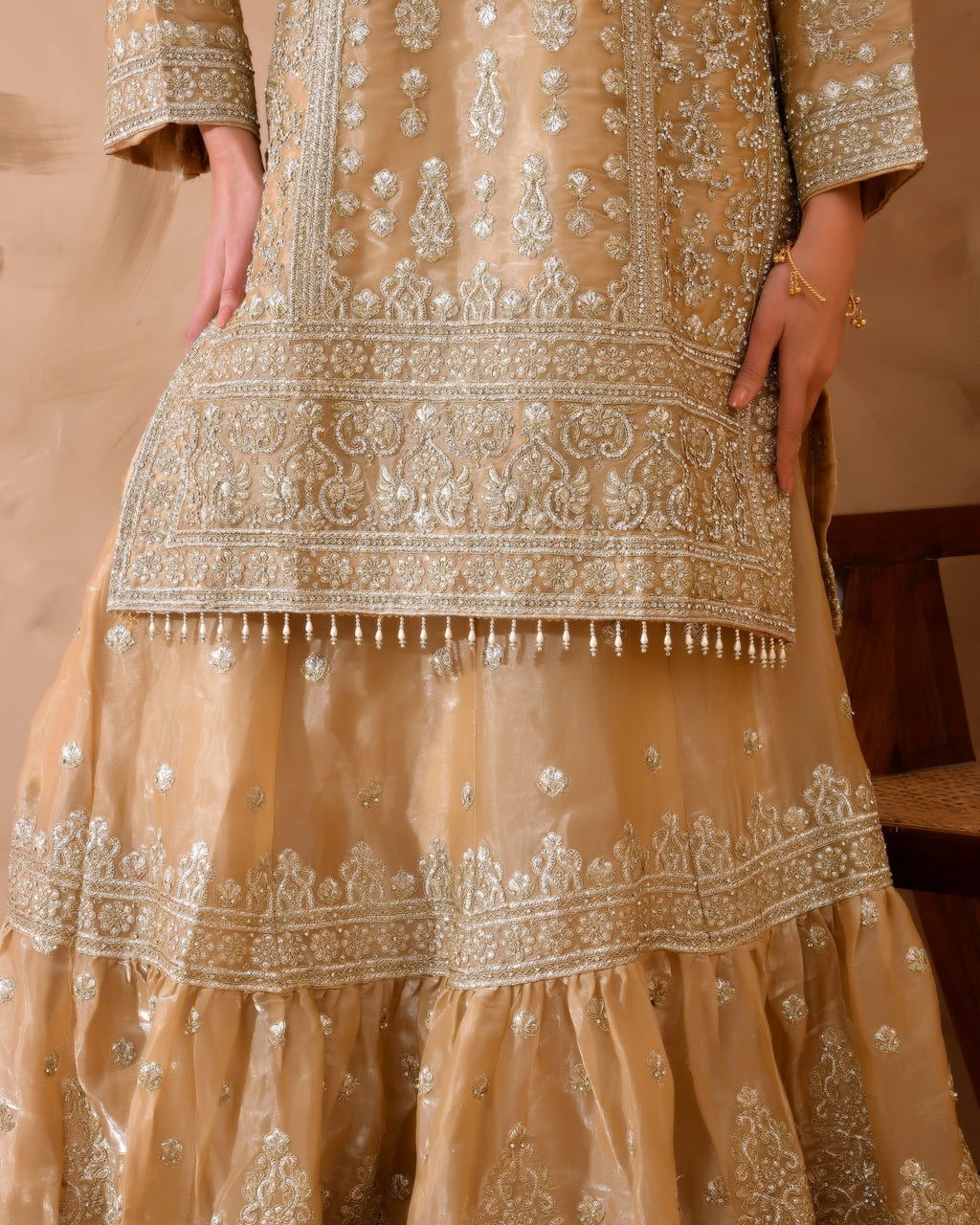 Organza suit with heavy zari and zarkan work