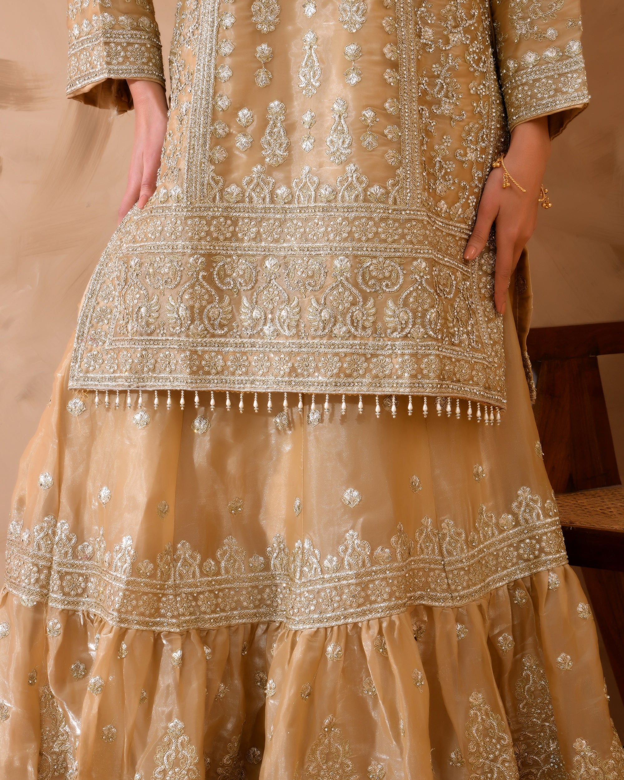 Organza suit with heavy zari and zarkan work