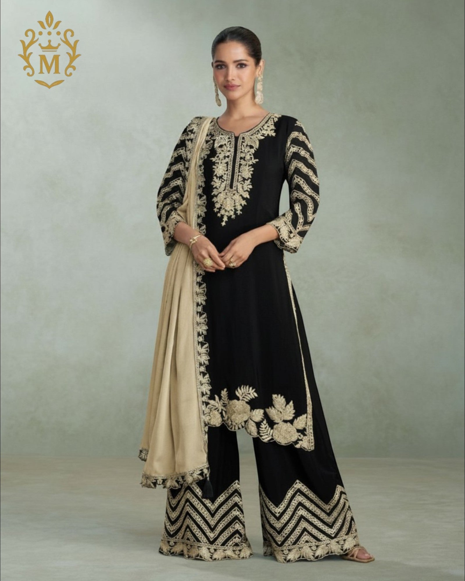 Maharani Royal Couture black chinon silk suit with heavy gold embroidery on kurta, palazzo pants, and dupatta.