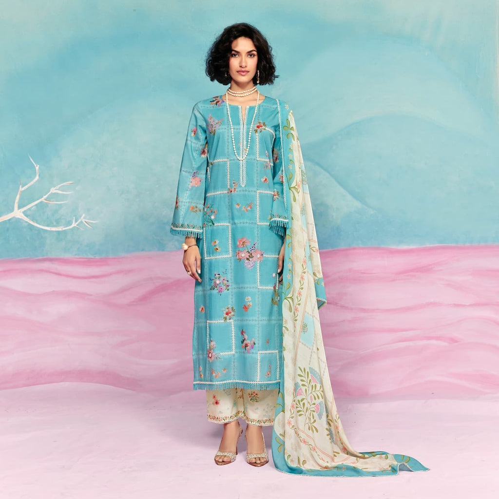 Maharani Royal Couture blue cotton lawn suit with floral print, crochet detailing on neckline and hem, and appliqué work.