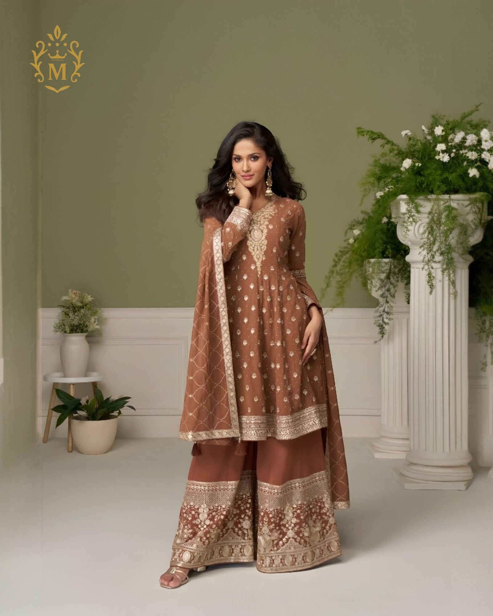 Maharani Royal Couture brown georgette suit with hand embroidery on neckline and sleeves, paired with heavy embroidered sharara and dupatta.