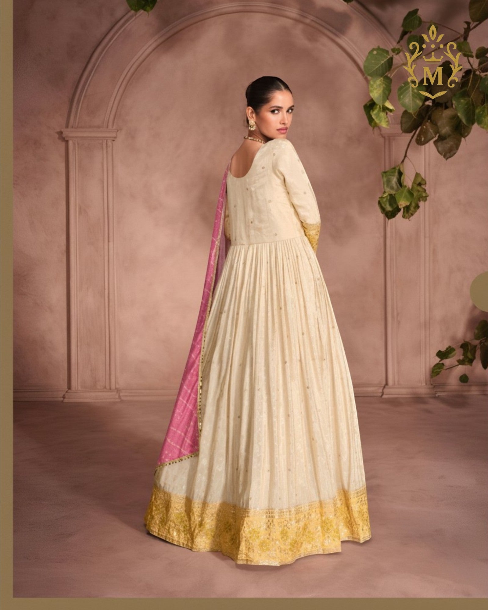 Maharani Royal Couture cream Anarkali gown in pure simar viscose jacquard silk with embroidered neckline and hem, paired with a pink Bandhani dupatta.