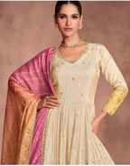 Maharani Royal Couture cream Anarkali gown with embroidered neckline and sleeves, paired with a pink and yellow Bandhani dupatta.