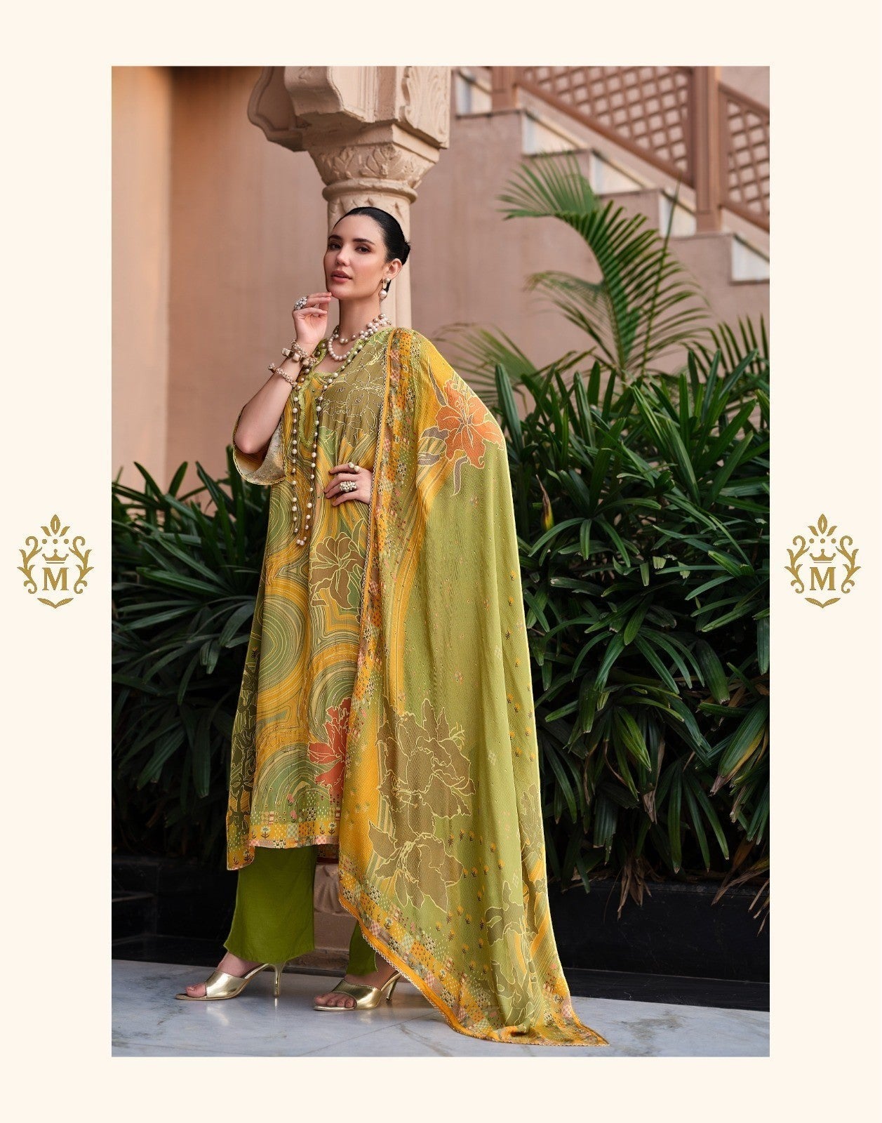 Maharani Royal Couture yellow and green mul cotton suit with digital print, dabka work, and lace finish. Model wears a flowing dupatta and solid bottoms.