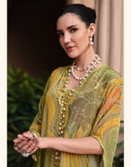 Maharani Royal Couture green and yellow mul cotton suit with digital print, dabka work, and lace finish. Model wears pearl necklace.