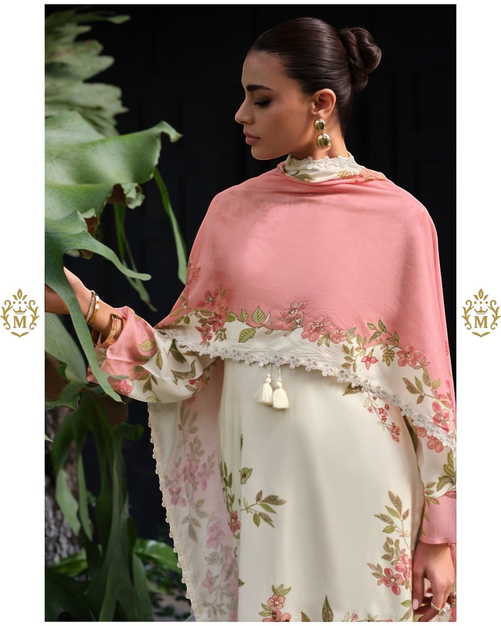 Maharani Royal Couture cream viscose muslin suit with digital floral print, lace trim, and pink dupatta. Model wears gold earrings.