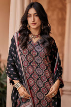 Maharani Royal Couture black viscose muslin suit with intricate digital print, mirror handwork, and tassels on dupatta.