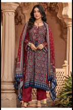 Maharani Royal Couture red viscose muslin suit with digital print, mirror handwork, and tassels. Paired with solid matte satin bottoms.