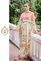 Maharani Royal Couture cream viscose muslin suit with digital floral print, handwork, lace trim, and pink dupatta. Model wears matching satin pants and pink heels.